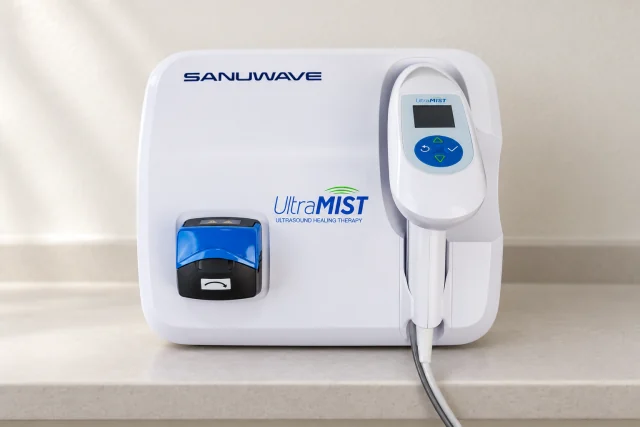 Illustrative photograph: SANUWAVE UltraMIST unit with its handpiece docked